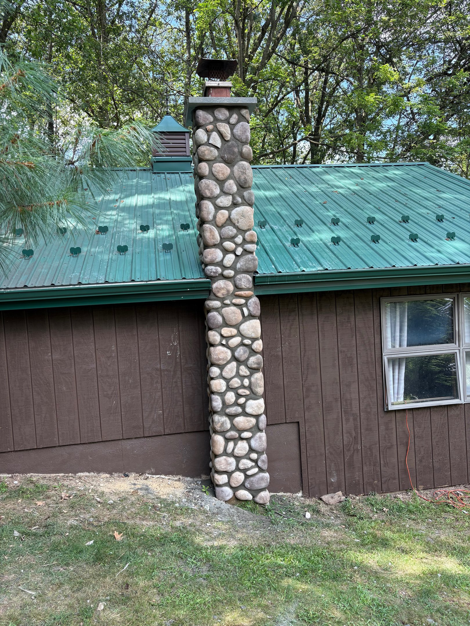 Tall natural stone chimney